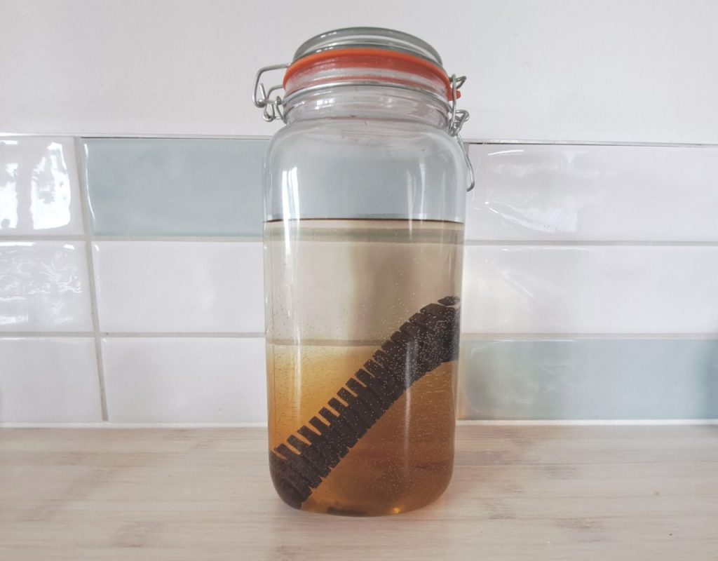 How To Make Whiskey (A Step-by-Step Guide) 19 Image of DIY Distilling aging whiskey on oak staves