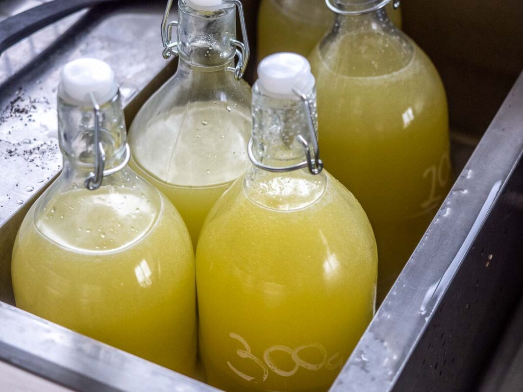 Image of DIY Distilling disolving sugar for limoncello in a water bath