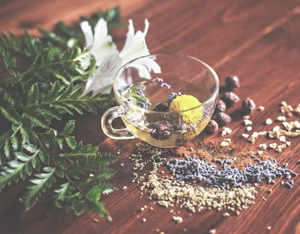 How To Make Essential Oils (Complete Guide) 2 a board covered in lavendar, nutmeg and other botanicals used to make essentail oils